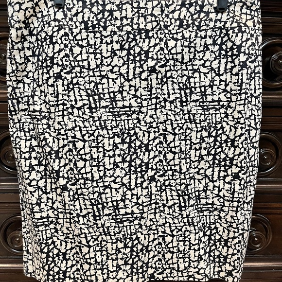 Lined skirt. Tan/Khaki with Black design. Back zipper. Back slit. - Picture 3 of 6